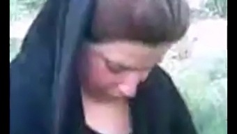 Amateur Arab Hijab-Wearing Woman Indulges In Outdoor Sexual Encounters