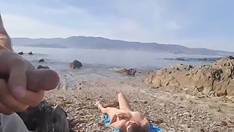A Nudist Milf Enjoys A Public Display Of A Man'S Genitals On The Beach